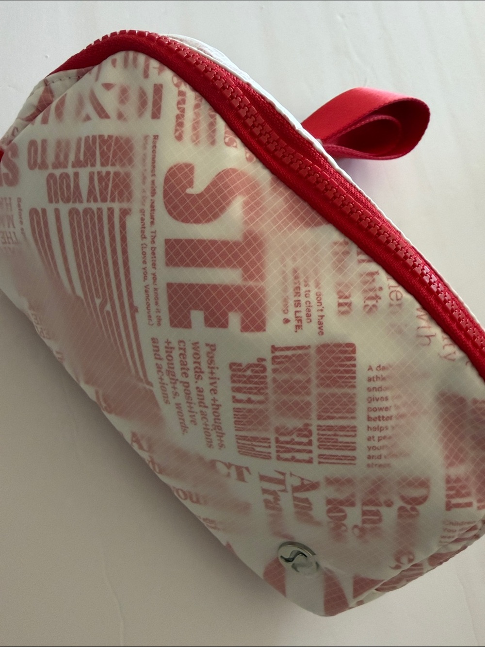 lululemon Everywhere Belt Bag 1L in the White/Red Manifesto Print nwt